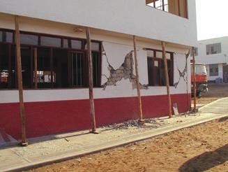 Figure 2 Seismic cracks of unreinforced adobe house.